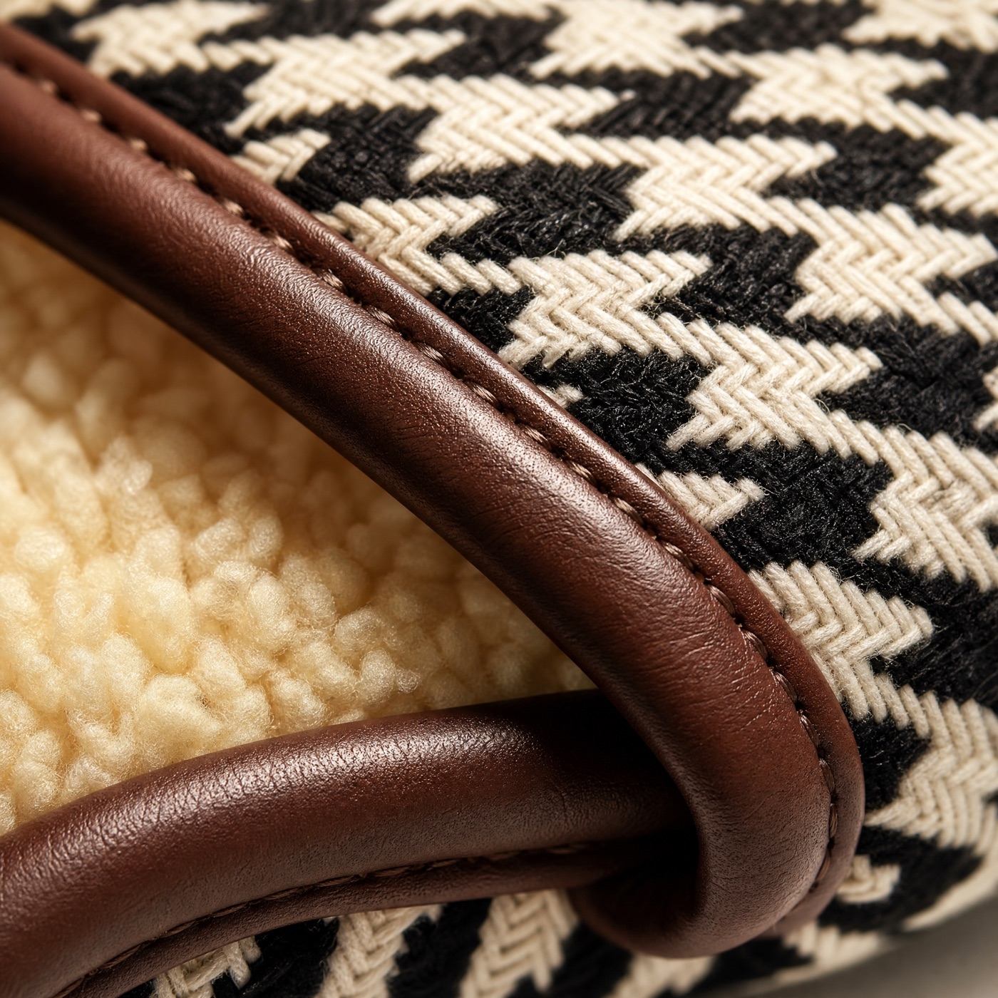 Macro of hand-finished brown leather trim and stitching